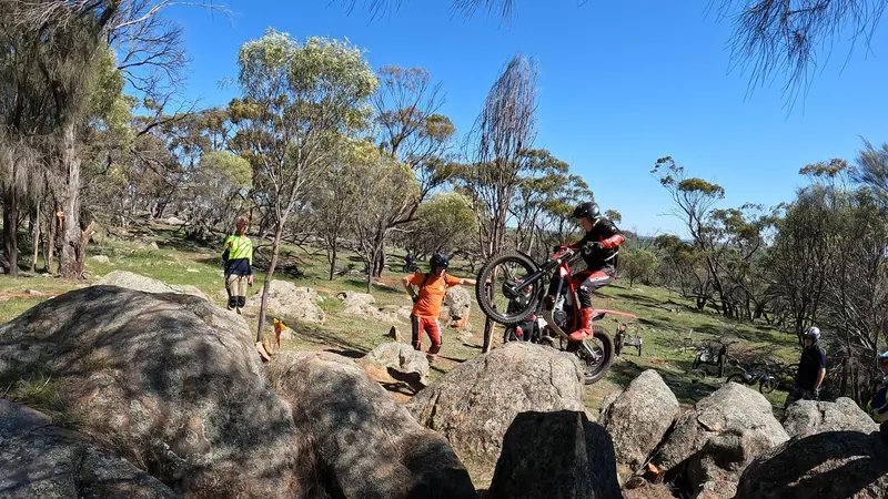 Pathfinders trials rider on natural rock terrain