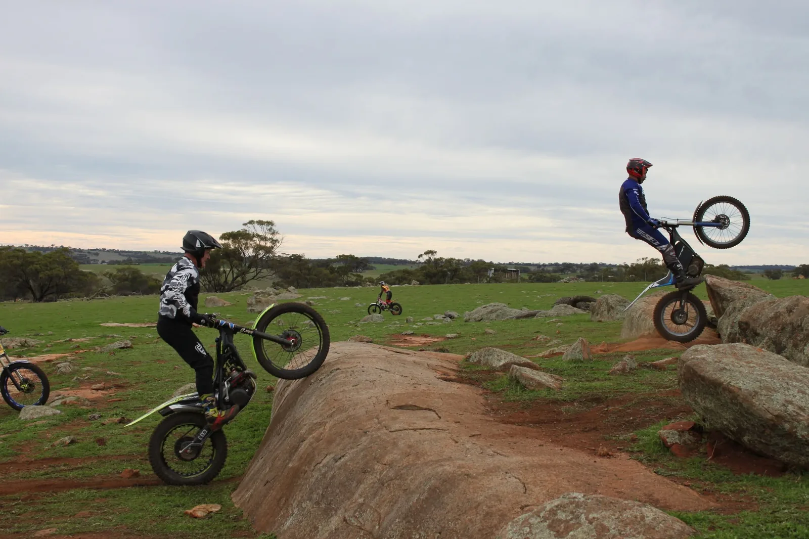 Trials riders spread across a rocky Western Australian property