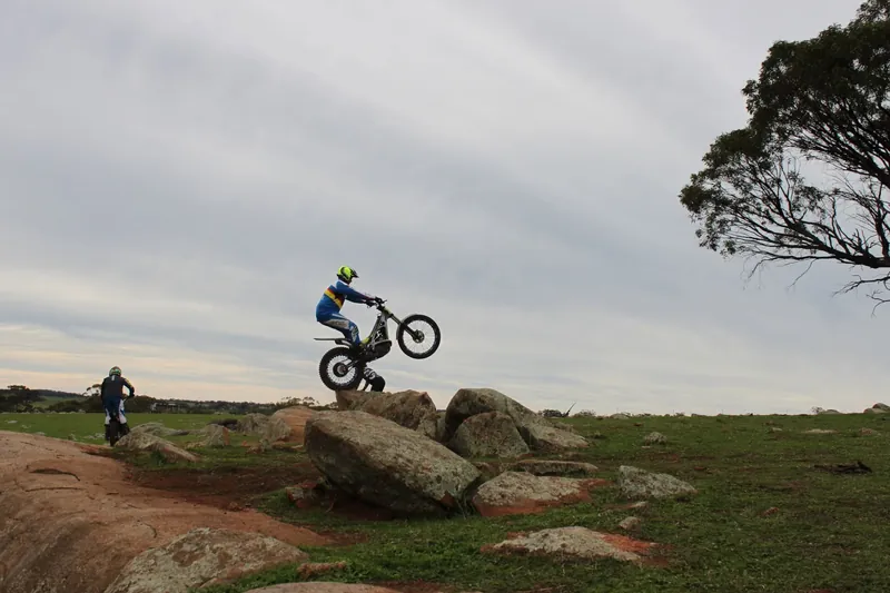 Pathfinders trials rider on natural rock terrain