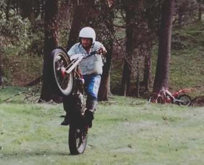 Pathfinders rider lifting the front wheel on a trials motorcycle