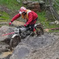 Trials competitor riding through technical natural terrain at the 2025 WA State Championships