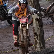 Trials rider balancing through a championship section in Western Australia