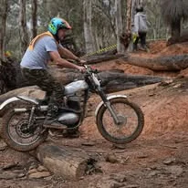 Trials competitor riding through technical natural terrain at the 2025 WA State Championships